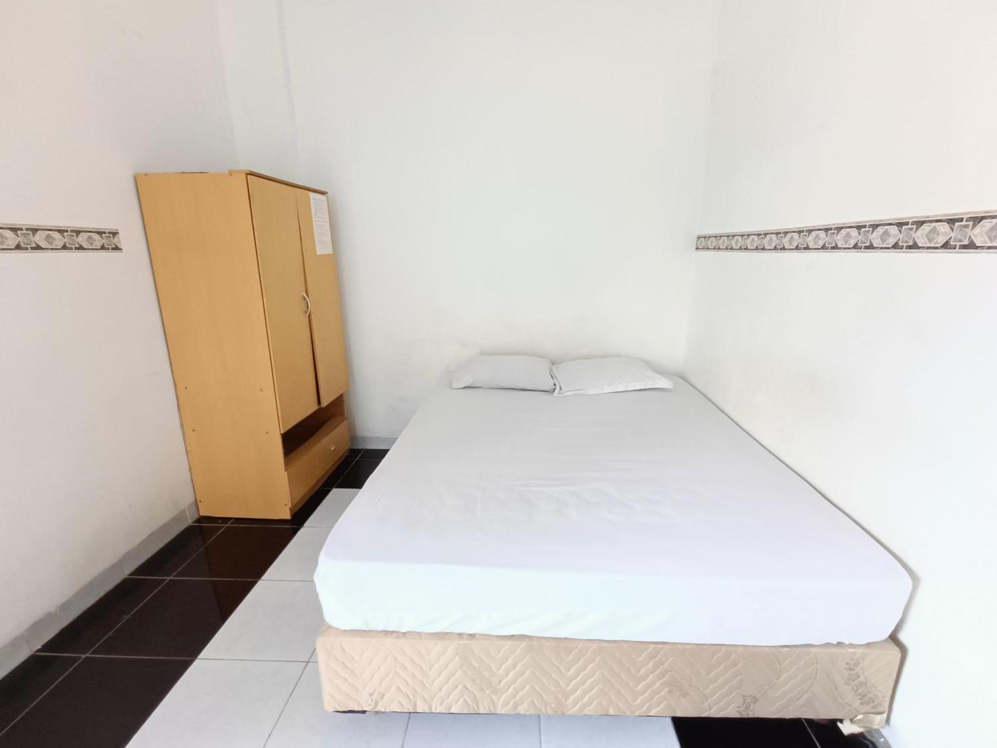 Bumi Merpati Residence Makassar Mitra Reddoorz Esterno foto